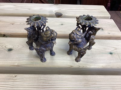 Lot 2486 - Chinese bronze censer, together with a Chinese bronze figure, a pair of Tibetan foo dog candlesticks and a pair of Japanese bronze pricket candlesticks (9)
