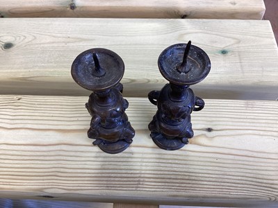 Lot 2486 - Chinese bronze censer, together with a Chinese bronze figure, a pair of Tibetan foo dog candlesticks and a pair of Japanese bronze pricket candlesticks (9)