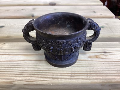 Lot 2486 - Chinese bronze censer, together with a Chinese bronze figure, a pair of Tibetan foo dog candlesticks and a pair of Japanese bronze pricket candlesticks (9)