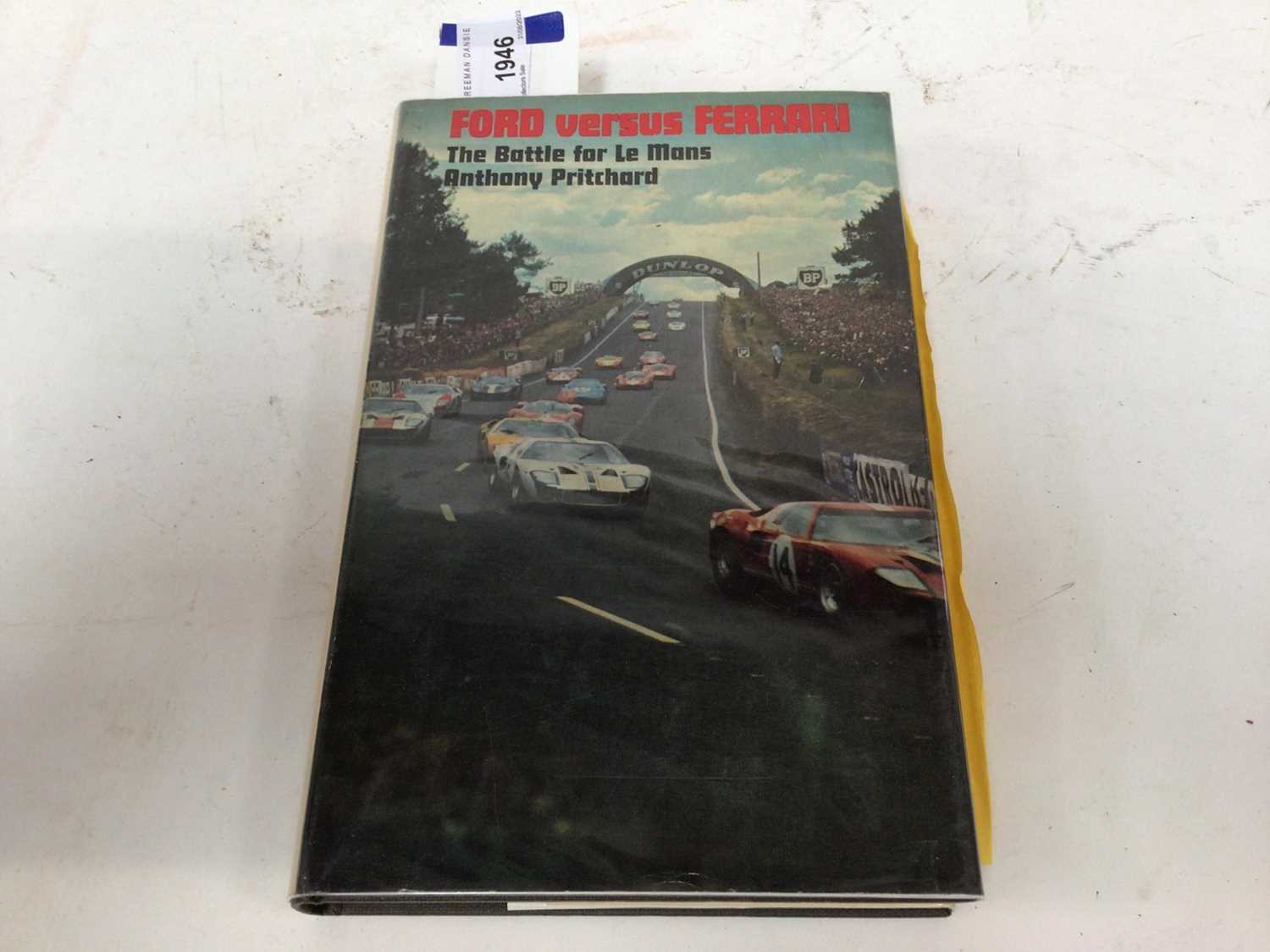 Lot 1946 - Books- Ford versus Ferrari, The Battle for Le Mans by Anthony Pritchard with Pelham books compliment slip, together with another later edition (2)