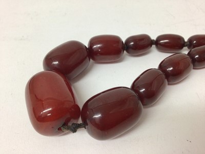 Lot 240 - Cherry red simulated amber necklace