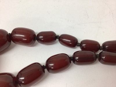 Lot 240 - Cherry red simulated amber necklace