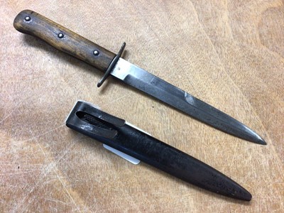 Lot 859 - Second World War Luftwaffe pilots boot knife with wooden grips, clipped spear pointed blade in steel scabbard with sprung clip 29 cm overall