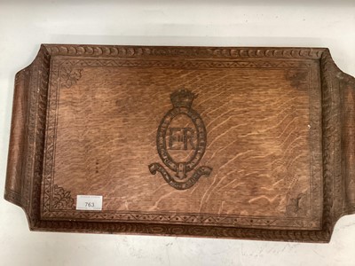 Lot 763 - Elizabeth II oak two handled tray with central carved badge for the Royal Artillery, signed and dated 1962 to reverse, together with a a carved coat of arms within shield, dated 1938 to reverse. Tr...