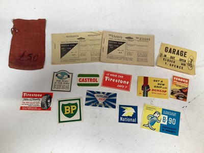 Lot 393 - Two Second World War fuel ration books, together with a group of original 1950's / 60's fuel and tyre advertising stickers