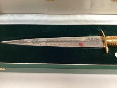 Lot 863 - Wilkinson Sword commemorative D-Day landings FS fighting knife with gold plated hilt, etched blade in fitted case