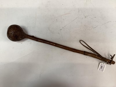 Lot 864 - Old African Knob Kerris with bulbous head on shaft with partial leather covering, 25cm in overall length.