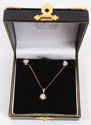 Lot 574 - Pair of diamond earrings and matching pendant