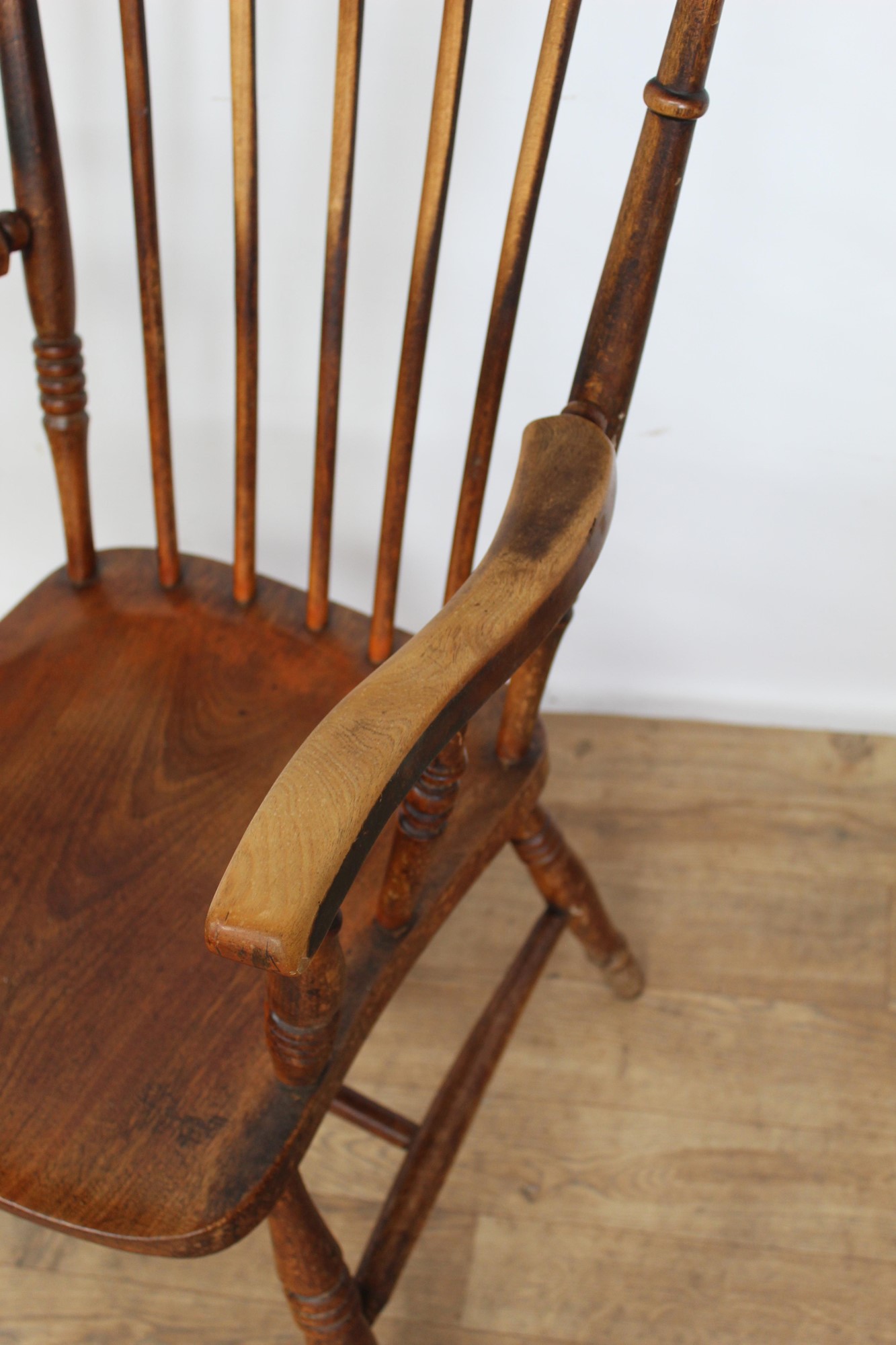 Lot 187 Antique beech high back spindle elbow chair