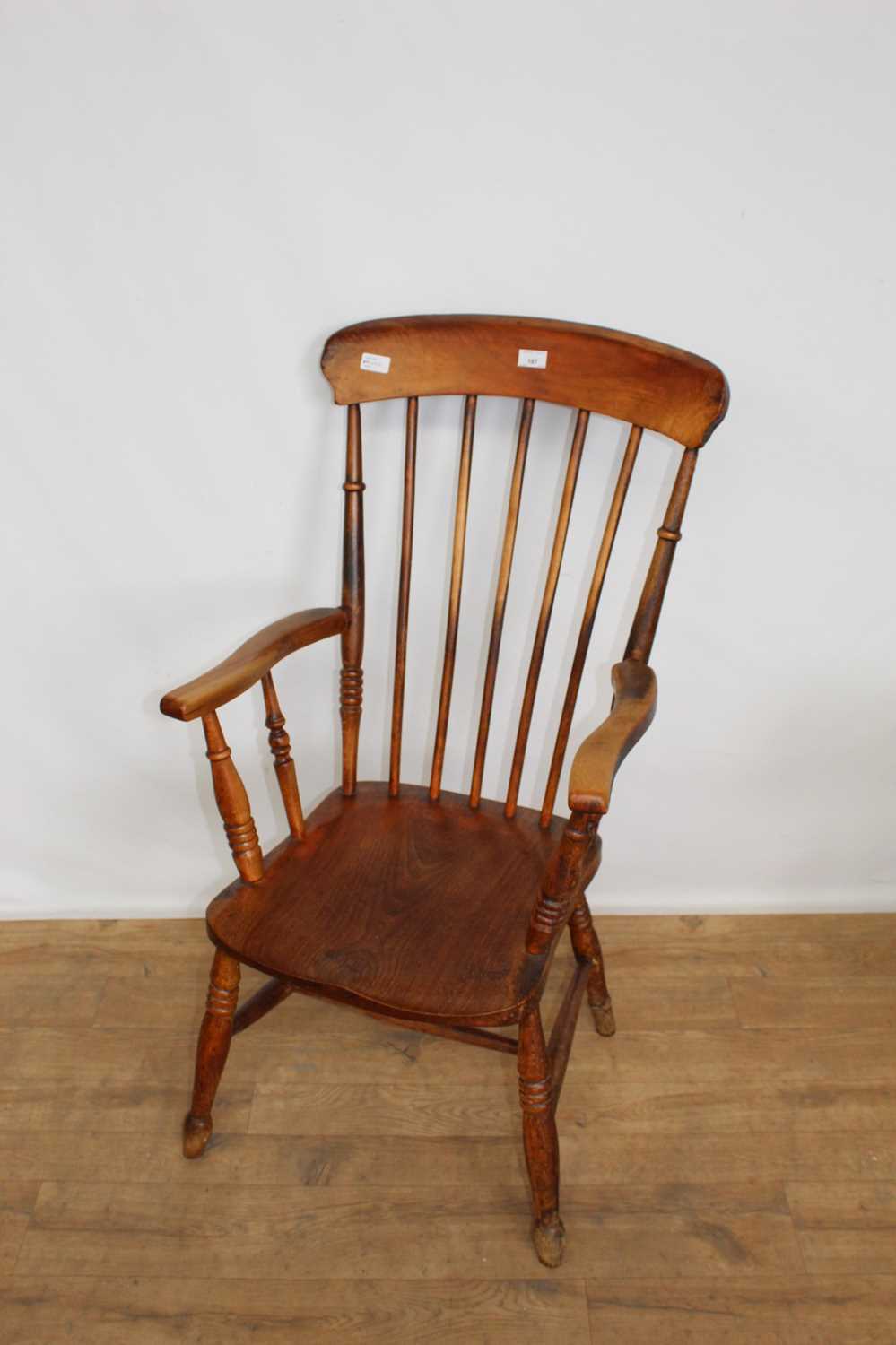 Lot 187 Antique beech high back spindle elbow chair