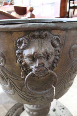 Lot 190 - Impressive large late 19th century Dutch brass planter with lions ring handles and embossed flowers on ornate base with pierced decoration 98cm high. The planter 55cm diameter.
