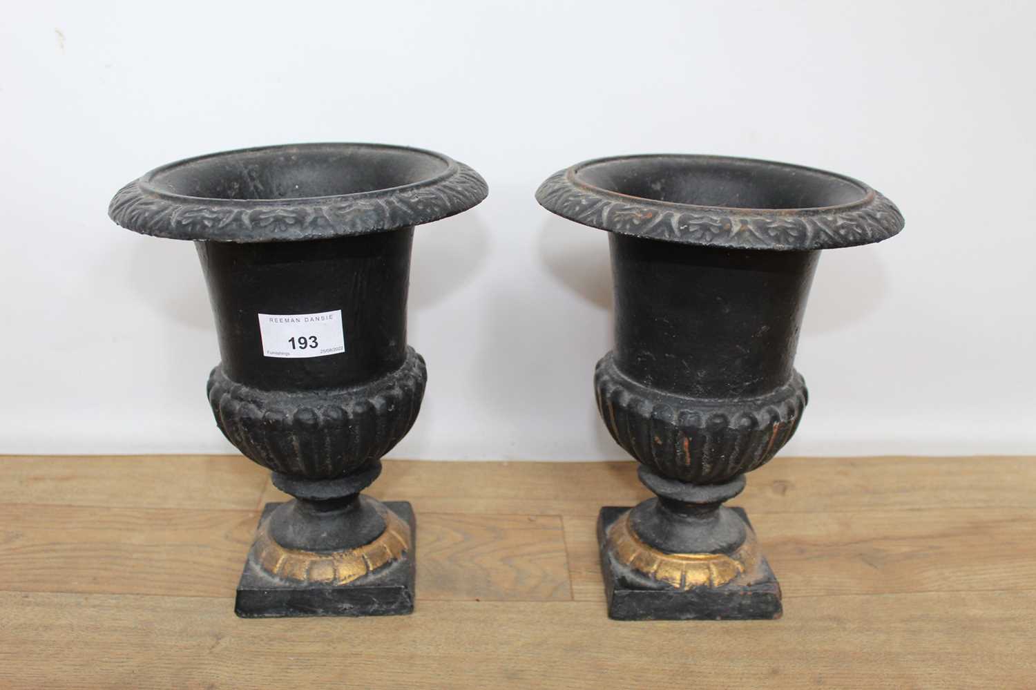 Lot 193 - Pair of Victorian-style black and gilt painted cast iron planters, 23cm high
