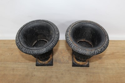 Lot 193 - Pair of Victorian-style black and gilt painted cast iron planters, 23cm high