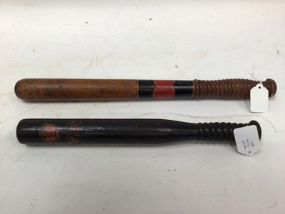 Lot 804 - Two Victorian painted Police truncheons, one with ' HAC' cartouche 44.5 cm, the other with crowned VR cipher 36 cm (2)