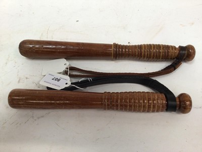 Lot 807 - Two W.P.C. Small truncheons with leather straps 26.5 -30 cm (2)