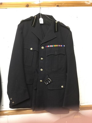 Lot 845 - Elizabeth II Police officers' jacket and trousers with buttons and mounted medal ribbons.