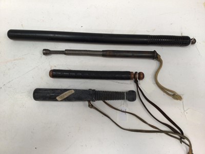 Lot 811 - Old Telescopic steel truncheon and three rubber truncheons (4)