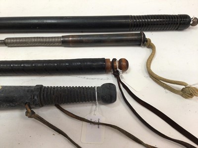 Lot 811 - Old Telescopic steel truncheon and three rubber truncheons (4)