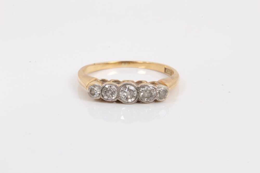 Lot 245 - Ladies gold 18ct diamond five stone ring