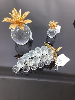 Lot 1300 - Large Swarovski crystal and gold coloured Pineapple, smaller ditto and a bunch of grapes (3)