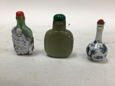 Lot 2513 - Three Chinese snuff bottles, including porcelain, glass and stone