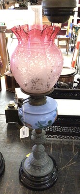 Lot 2531 - Edwardian Duplex oil lamp, with blue glass resavouir and etched cranberry glass shade, 65cm in overall height.