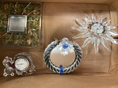 Lot 1306 - Swarovski crystal Solaris table clock together with a Kris bear table clock and two photograph frames (4)