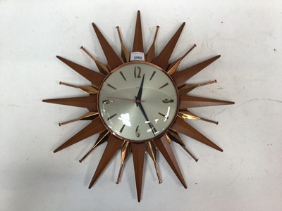 Lot 2562 - Metamec copper and wood sunburst clock, 45cm wide