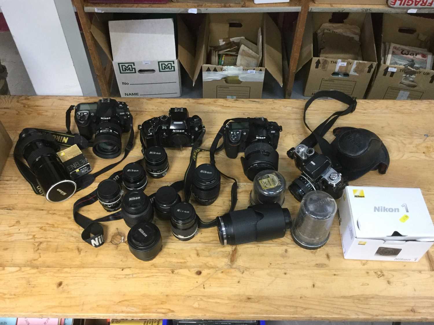 Lot 2369 - Good collection of Nikon 35mm and DSLR cameras, together with various lenses, including a Nikon F2, Nikon F4, Nikon D300, etc