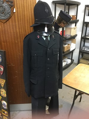 Lot 851 - Royal Ulster Constabulary uniform comprising helmet with badge, peaked cap with badge, jacket and trousers