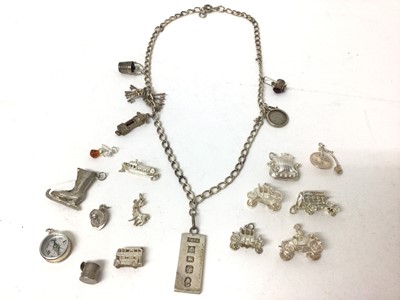 Lot 269 - Lot white metal and silver charms and silver ingot pendant on chain
