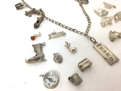 Lot 269 - Lot white metal and silver charms and silver ingot pendant on chain