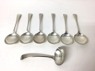 Lot 284 - Six George V Old English pattern soup spoons, together with a matching ladle (Sheffield 1932), all 15ozs