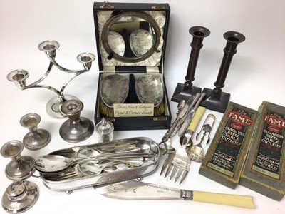 Lot 286 - Pair of silver brushes and a silver mirror in fitted case, together with a silver candlestick, silver and white metal flatware and other plated items.