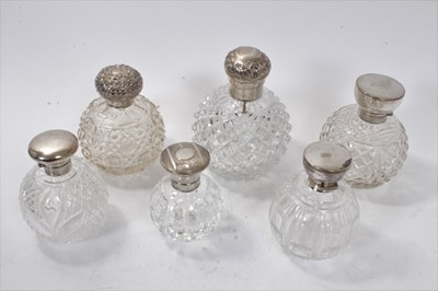 Lot 392 - Six Victorian and later silver topped scent globes with cut glass globular bodies