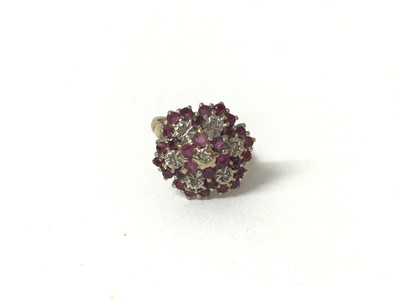 Lot 288 - 9ct gold ruby and diamond flower head cluster ring