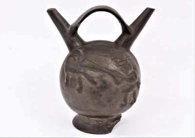 Lot 92 - Ancient pre-Columbian pottery vessel with loop handle and 
twin spouts, moulded figures with clubs hunting big cats.