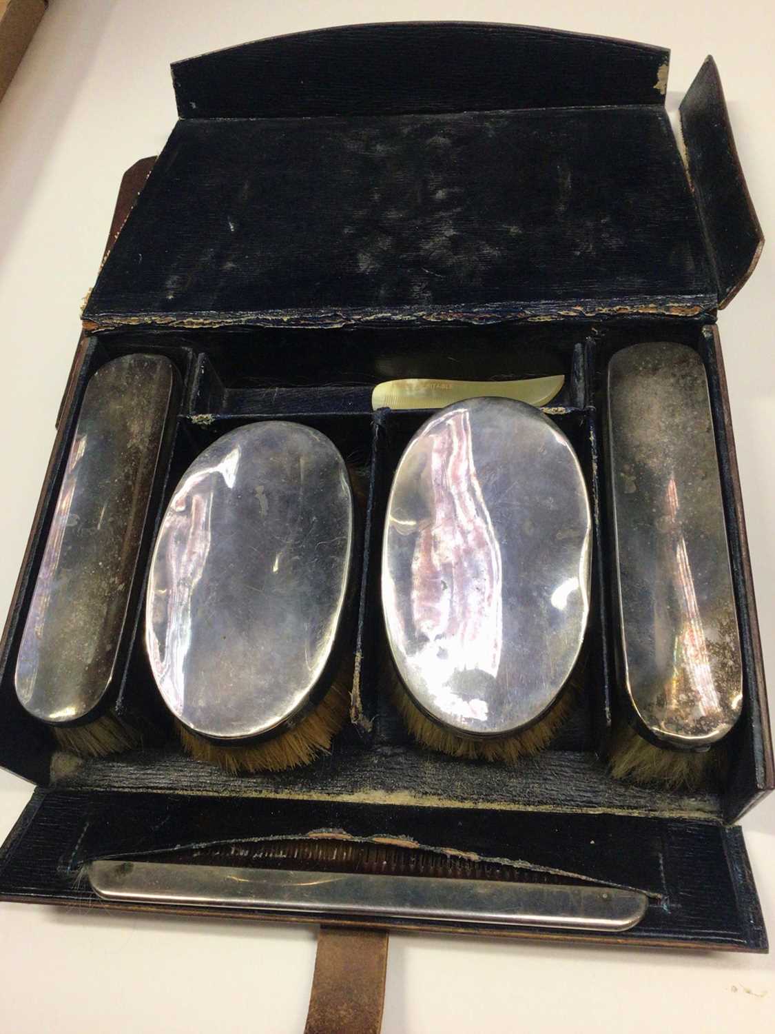 Lot 65 - Early 20th century silver brush set (London 1906) in fitted leather case