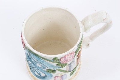 Lot 96 - A Compton Pottery mug with silver shape handle.