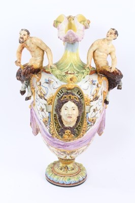 Lot 101 - 19th century Italian majolica ewer vase with fawn supports 
and mask decoration (damaged).