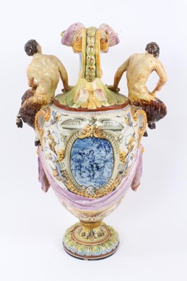 Lot 101 - 19th century Italian majolica ewer vase with fawn supports 
and mask decoration (damaged).