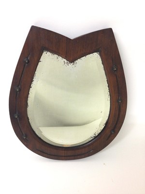 Lot 1417 - Edwardian mahognany bevelled glass mirror in the shape of a horse shoe