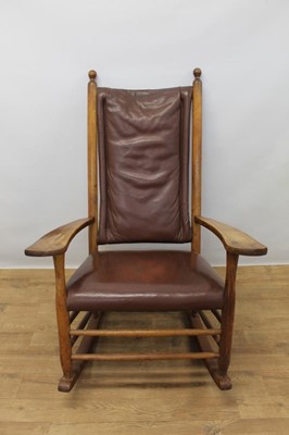 Lot 1322 - Arts and Crafts fruitwood country rocking elbow chair with leather 
upholstery.