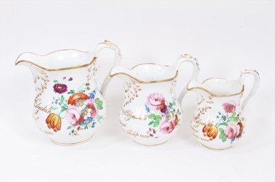 Lot 17 - Three graduated Staffordshire porcelain jugs named and 
dated 1856.