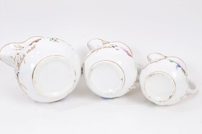 Lot 94 - Three graduated Staffordshire porcelain jugs named and 
dated 1856.
