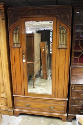 Lot 1328 - Edwardian Art Nouveau walnut wardrobe with glazed panels and 
carved floral scrollwork.