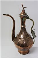 Lot 896 - 19th century Islamic copper and brass ewer,...