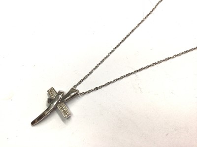 Lot 1122 - 9ct white gold diamond set stylised cross pendant on silver chain