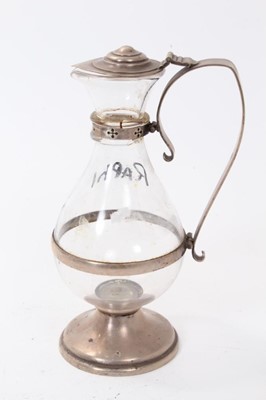 Lot 214 - 1920s silver mounted glass communion wine flagon of baluster form with hinged silver cover