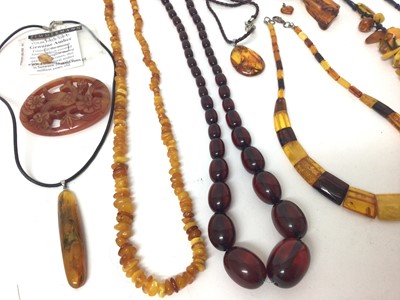 Lot 149 - Group amber bead necklaces and pendants including a simulated cherry amber necklace